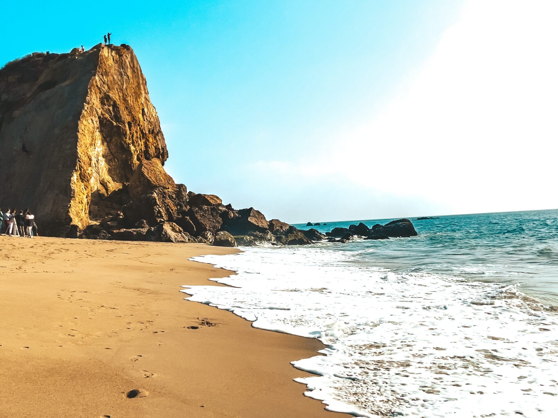 a rocky beach next to the ocean on a custom los angeles rock climbing adventure