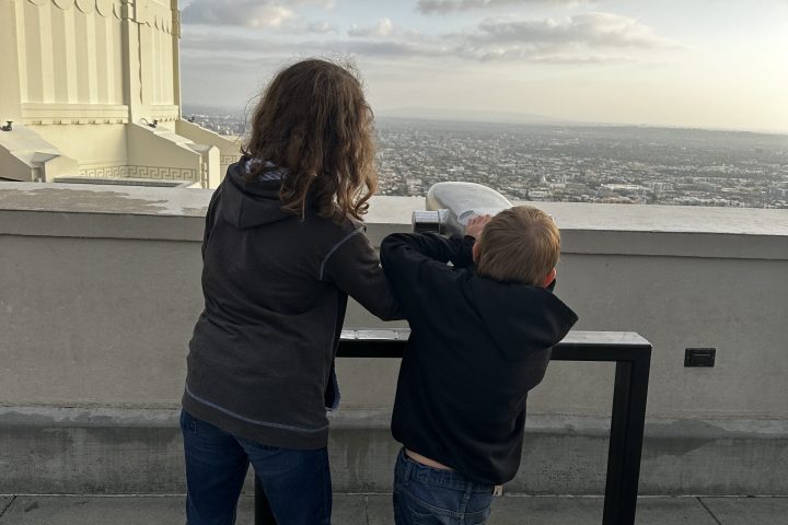 Kids looking through the telescope on top the Griffith Observatory
