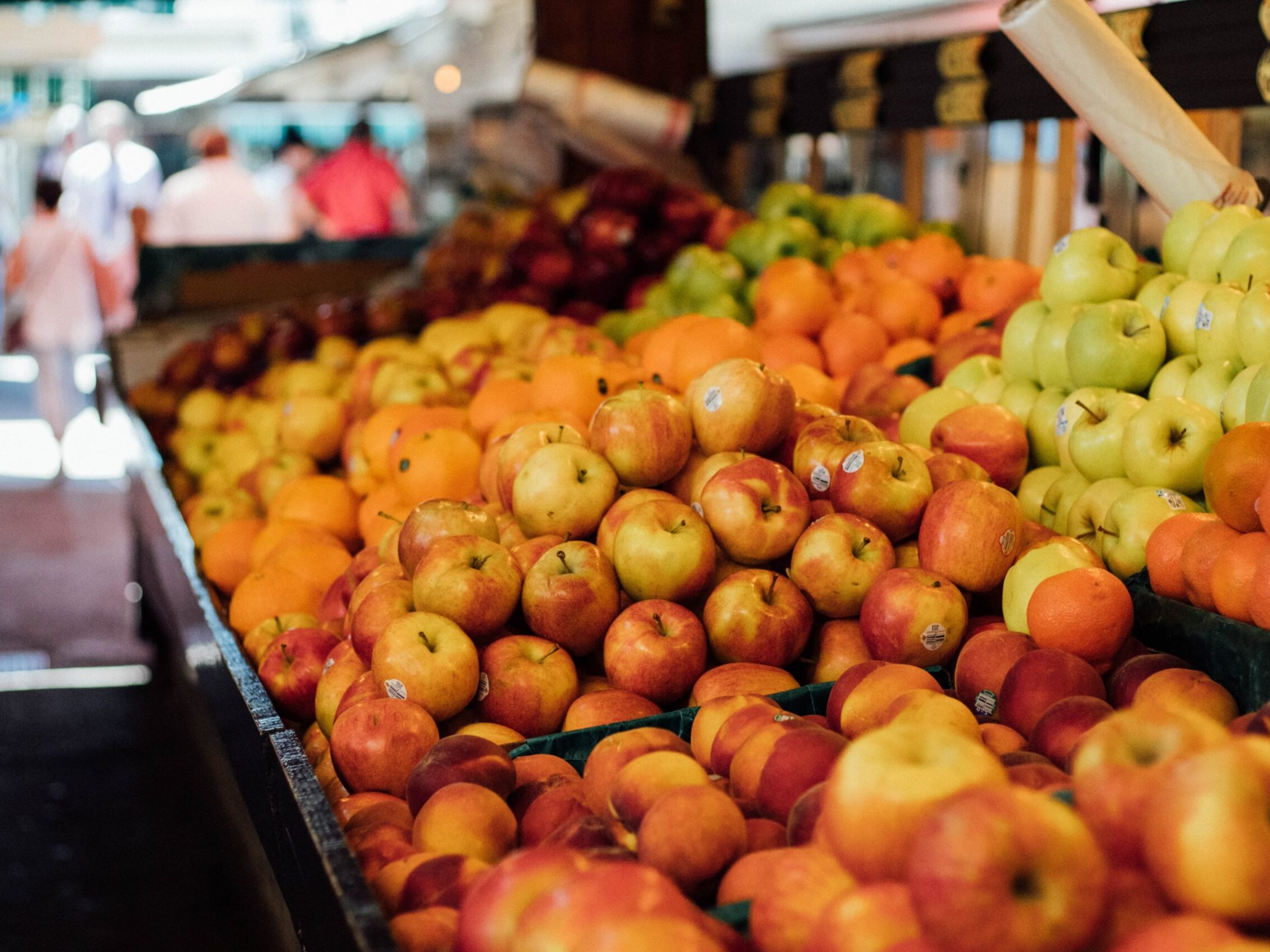 a store filled with lots of fruit and vegetables on display