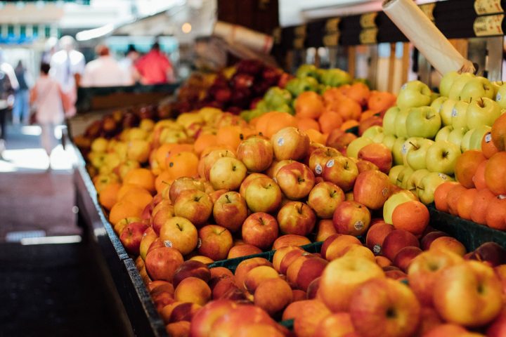 a store filled with lots of fruit and vegetables on display