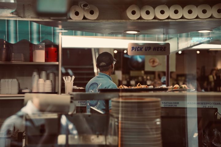 a man standing in front of a store
