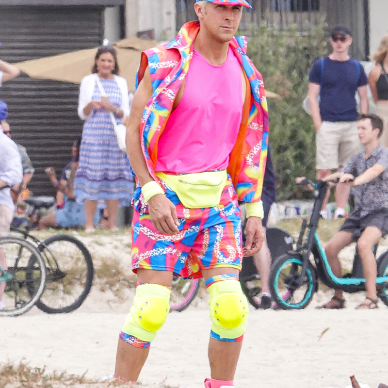 a group of people standing next to a bicycle