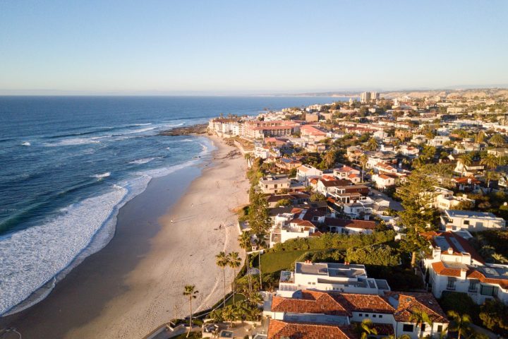 a view of a beach next to a body of water