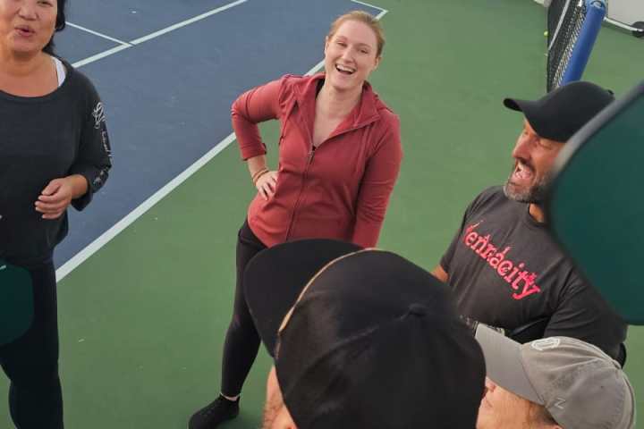 a group of people around each other