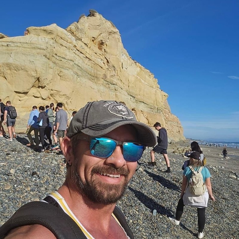 a group of people standing on top of a mountain