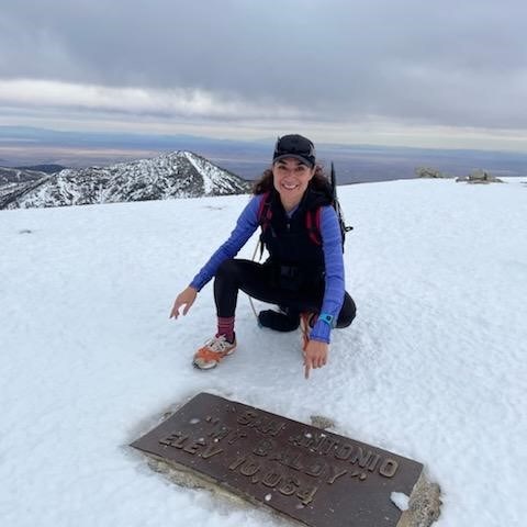 a person that is standing in the snow