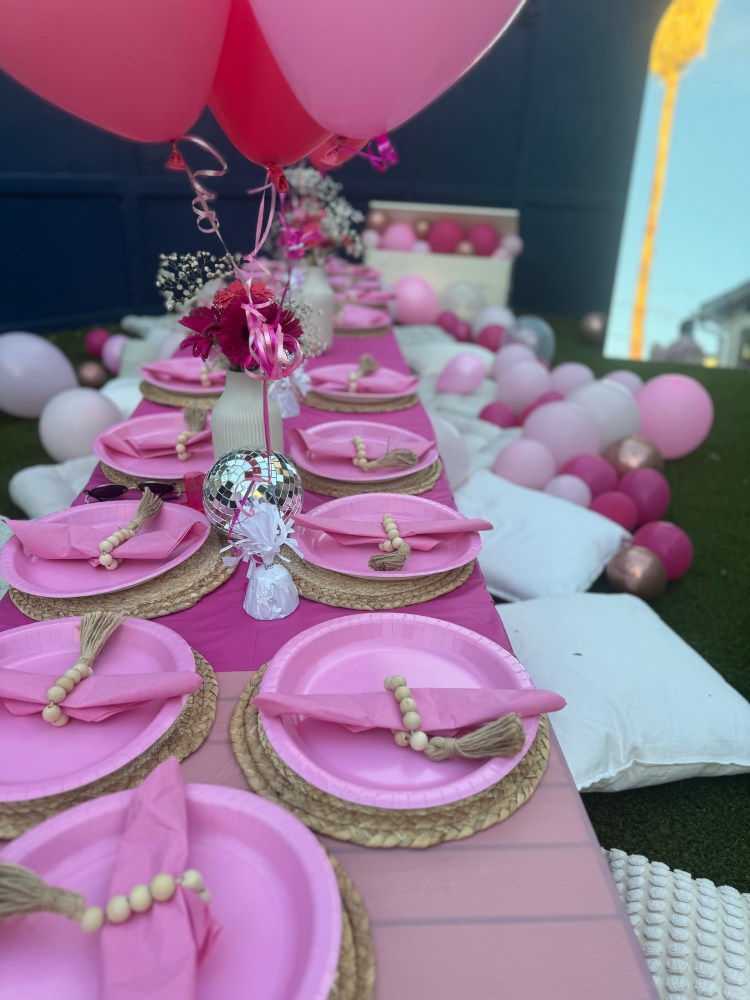 a group of pink flowers on a table