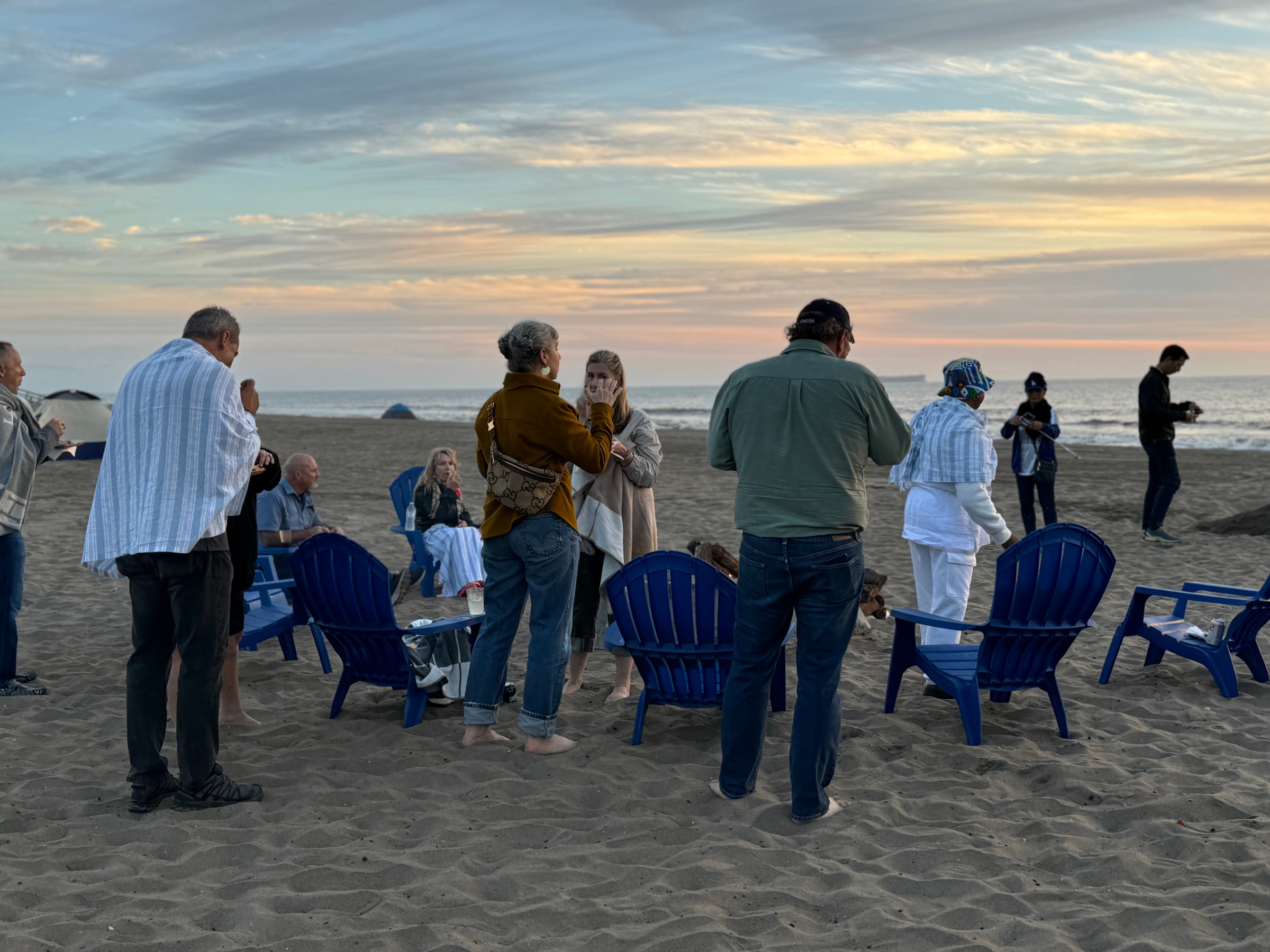 a group of people on a beach