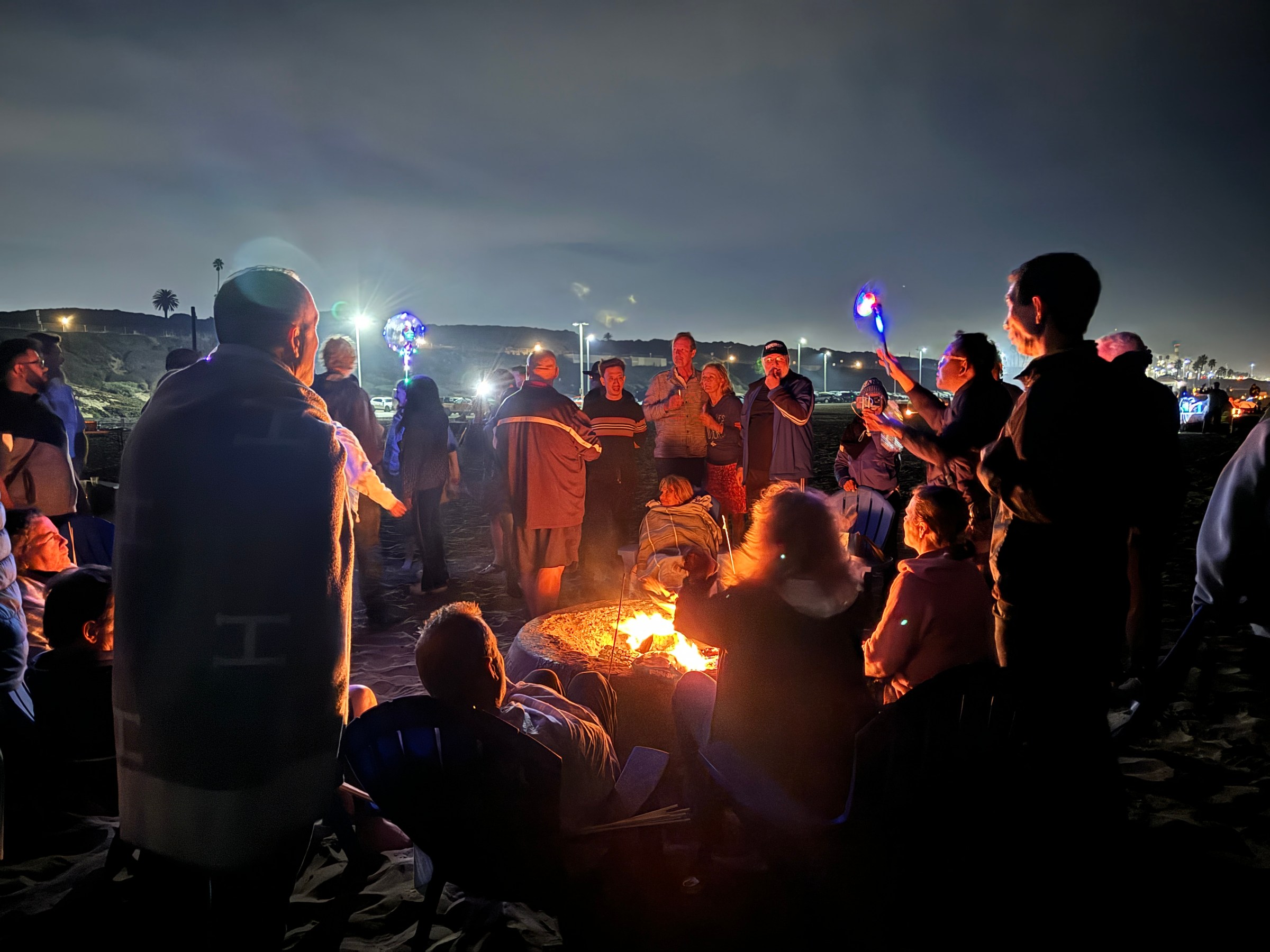 a group of people standing on a stage in front of a crowd